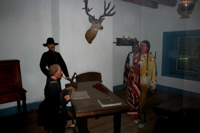 Commandant Talking to Two Indians in His Office